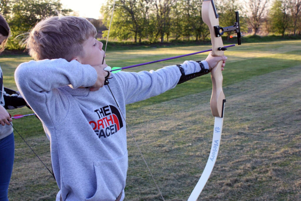 Boy Shooting A Club Recurve Bow