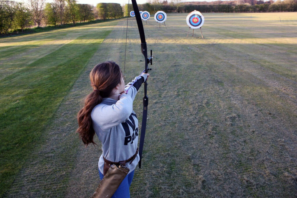 Girl Shooting A Recurve Bow