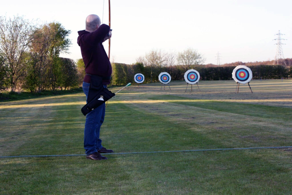 Man Shooting An English Longbow
